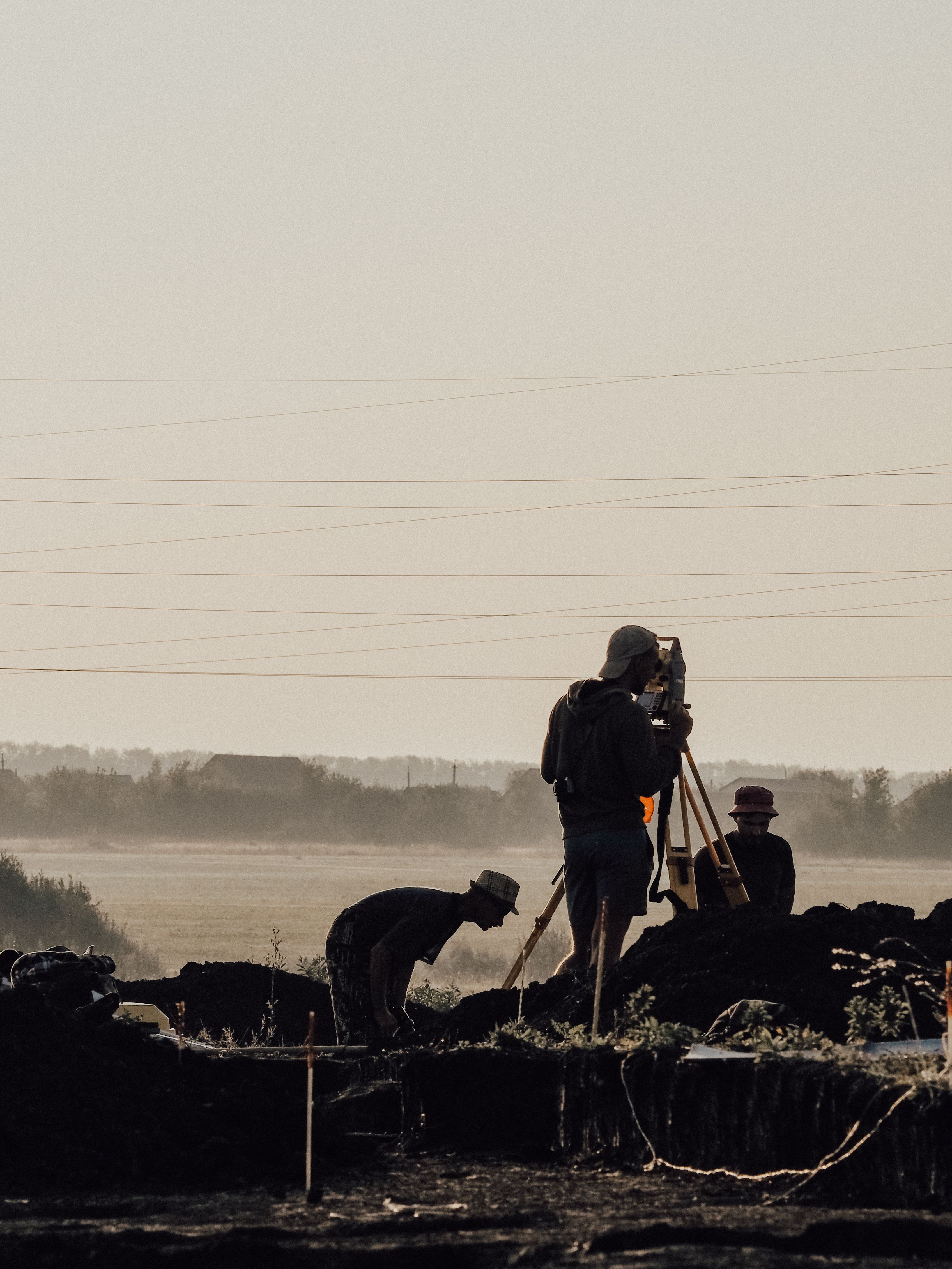 Professional land surveying equipment and surveyor at work